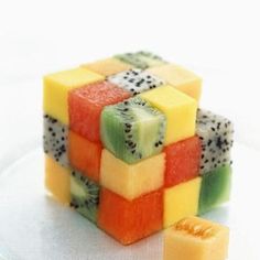 a close up of a fruit cube on a plate