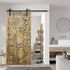 an ornate gold door is open to reveal a bathroom with white walls and wood floors