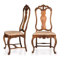 two wooden chairs with carved back and upholstered seat, one in the shape of a vase