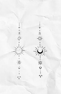 the sun and moon are drawn on paper