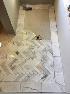 the bathroom floor is being remodeled with marble