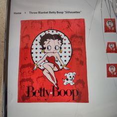 an advertisement for betty boop hangs on the wall