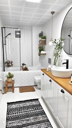 a white bathroom with black and white decor