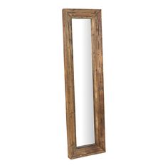 a wooden mirror sitting on top of a white wall