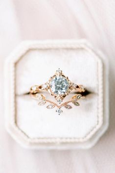 an engagement ring with a blue diamond in it