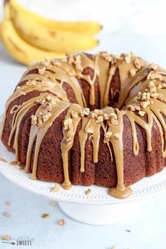 a bundt cake covered in peanut butter and drizzled with icing