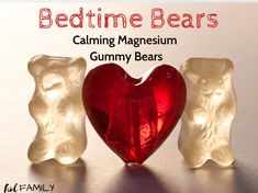 two gummy bears are next to a red glass heart with the words bedtime bears on it