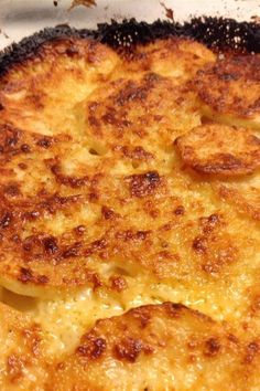 a cheesy dish is shown in a pan