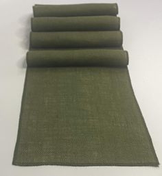 four pieces of green fabric laid on top of each other