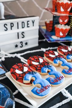 Spider man birthday party dessert cookies decor Spider Man 3rd Birthday Party Cake, Spider Man Themed Birthday Party Ideas, 1st Birthday Spiderman Theme, 2nd Spiderman Birthday, Modern Spider Man Birthday Party, Vintage Spiderman Birthday Party, Marvel 2nd Birthday Party, Marvel Third Birthday Party