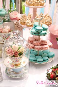 a table topped with lots of different types of cakes and cupcakes next to each other