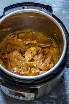 a pot full of food sitting on top of a table