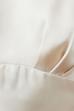 close up view of the back of a white dress