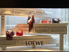 a window display with handbags and purses