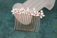 Wedding Hair Comb, Bridal Hair Comb, Crystal Bridal Comb, Silver Wedding Hair Comb, Crystal Headpiece, Bridal Side Comb It's definitely on the smaller side for formal hair combs, but, if you don't want anything too large, or had too many parts branching out everywhere. It's perfect for a wedding- simple, but not understated, unique but not costume-like! This tiny beautiful and delicate silver tone hair comb is made with a clear rhinestone and Swarovski pearl. Perfect for a special occasion or to a add something lovely to your party attire.  Size :  Small size : The rhinestone part is measured approx.  2.25 " long and 0.5" wide.  Large size  : The rhinestone part is measured approx.  3" long and 0.75" wide.  Tone color: Silver Tone ,Gold tone and Rose gold tone . Pearl color : Swarovski whi Side Comb Wedding Hair, Hair Bling, Gold Bridal Hair Comb, Bridal Hair Combs Pearl, Wedding Comb, Wedding Hair Jewelry, Formal Hair, Hair Accessories Wedding, Wedding Simple