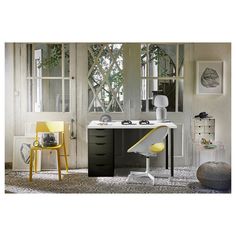 a white desk with yellow chairs in a room