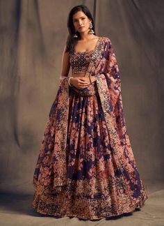 Elevate your elegance with our Purple Embroidered Floral Digital Printed Organza Bridal Lehenga Choli. This traditional wear brings a touch of Indian heritage to your wardrobe. The intricate embroidery and digital print showcase a fusion of modern and traditional styles, perfect for any wedding celebration. Available in a readymade design for hassle-free beauty. The unstitched blouse can be customized upto 46 inches. Do Note: All the accessories shown are for styling purpose only. Slight color v Purple Lehenga Color Combos, Lehenga Color Combos, Wedding Chaniya Choli, Purple Lehenga, Ghaghra Choli, Bridesmaid Lehenga, Indian Lehenga Choli