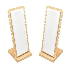 two wooden frames with white paper on them