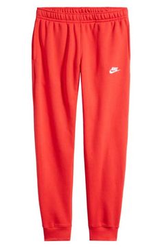 An embroidered Swoosh marks the pocket of these sweatpants made for comfort from fleece with a sporty fit that slims at the ankle. 28 1/2" inseam; 10" leg opening; 12 1/2" front rise; 16 1/2" back rise (size Medium) Elastic/drawstring waist Side-seam pockets; back welt pocket Cotton/polyester Machine wash, tumble dry Imported Nike Joggers With Ribbed Waistband For Jogging, Nike Casual Joggers For Leisure, Nike Sporty Joggers For Leisure, Casual Nike Joggers For Leisure, Sporty Nike Joggers For Leisure, Red Sporty Sweatpants For Leisure, Nike Solid Color Athleisure Joggers, Nike Fleece Joggers For Leisure, Nike Sweatpants For Spring Streetwear