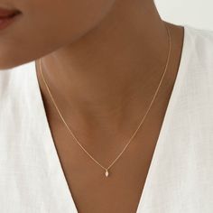 Featuring a marquise diamond drop on a 14k yellow gold chain, the Aletta Necklace is an elegant and understated piece for any occasion.


Lab grown marquise diamond size: 2.2mm x 4.2mm

Total carat weight: 0.08 

14k yellow gold  

Necklace can be worn at 16”, 17”, and 18” Marquise Diamond Pendant Designs, Small Diamond Necklace Simple, Gold Necklace Aesthetic, Marquise Diamond Necklace, Simple Diamond Necklace, Small Diamond Necklace, Marquise Necklace, Minimal Gold Jewelry, Diamond Necklace Pendant