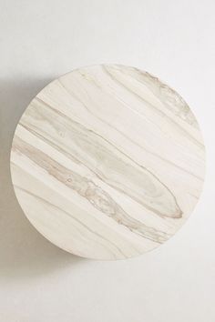 a white marble plate sitting on top of a table