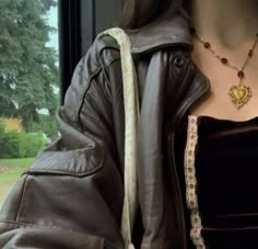 a close up of a person wearing a leather jacket