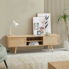 a living room scene with focus on the coffee table and sideboard in the foreground