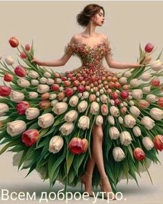 a woman in a dress made out of flowers and tulips is standing with her hands on her hips