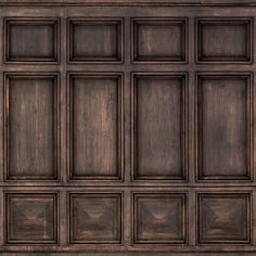 an old wood paneled wall with square and rectangle panels