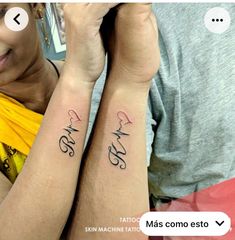 two people with matching tattoos on their arms, one has the word love and the other has