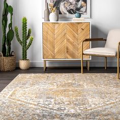 a living room area with a rug, chair and potted plant