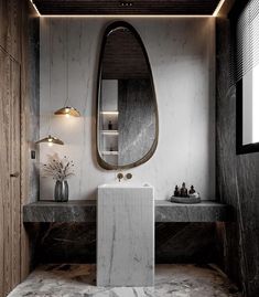 a modern bathroom with marble counter tops and walls