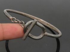 "925 Sterling Silver - Vintage Dark Tone Chained Loop Bangle Bracelet - BT8453  Jewelry Type:         Bracelet  Metal Type:            925 Silver  Metal Size:             6.75\" Length  .75\" Height   Stone Type:            N/A  Condition:              N/A  Jewelry Weight:     20.9 Grams  PLEASE NOTE: THIS ITEM IS PRE-OWNED. ALTHOUGH MOST ITEMS ARE IN VERY GOOD CONDITION, SOME MAY NEED CLEANING AND/OR MINOR REPAIRS. WE MAKE A VERY STRONG EFFORT TO UPLOAD CLEAR PICTURES. PLEASE INSPECT ALL PICTURES AND ASK ALL QUESTIONS YOU MAY HAVE PRIOR TO MAKING A PURCHASE. NOT ALL STONES ARE GENUINE, SOME ARE ENHANCED OR CREATED." Silver Smithing, Industrial Jewelry, Clear Pictures, Bracelet Metal, Chain Loop, Jewelry Inspo, Metal Bracelets, Bangle Bracelet, Jewelry Inspiration