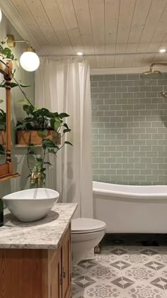 a bath room with a tub a sink and a mirror on the wall next to a toilet