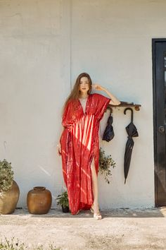 Switch to vacay mode anytime with the Goddess - Tie Dye Kaftan Maxi Dress in red coral. This undeniably sexy, breezy maxi dress will have you dreaming of the wind in your hair, the sound of the ocean waves, and the sand under your feet. Experience blissful comfort and breathability whether you’re at home or on vacay with the gorgeous flowy long dress and laid-back loose fit. Crafted in 100% soft, lightweight rayon, this dress features flawless tie-dye patterns and is perfect for tropical beachsi V-neck Maxi Dress For Beach Cover-up During Resort Season, Bohemian Maxi Dress For Resort Season, Bohemian Maxi Beach Dress For Resort Season, Red V-neck Maxi Dress For Beach Party, Beachwear Maxi Dress For Resort Season, Floor-length Beach Dress For Beach Season, Summer Floor-length Beach Dress, Floor-length Beach Dress, Flowy Maxi Beach Dress For Resort