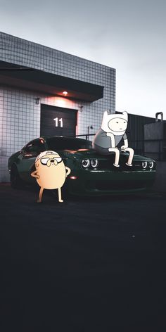 two cartoon characters sitting on top of a green sports car in front of a building