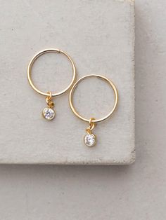 CZ Charm Hoops by The Faint Hearted Jewelry Jewelry Trending, Cute Hoop Earrings, Small Hoop Earrings With Natural Stones For Everyday, Everyday Small Hoop Earrings With Natural Stones, Gold-tone Small Hoop Earrings, Small Hoop Gold-tone Pierced Earrings, Gold Opal Small Hoop Earrings, Layering Earrings, 14k Gold Hoop Earrings