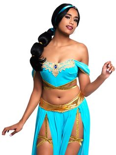 a woman in a blue and gold costume posing for the camera with her hands on her hips