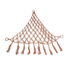 a pink net hanging from the ceiling with tassels on it's sides