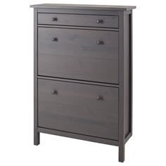 a gray dresser with three drawers on it