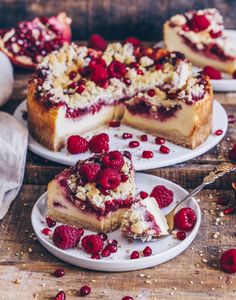 two plates with raspberry cheesecake on them