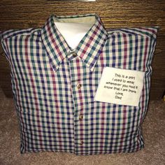 a plaid shirt with a note attached to it