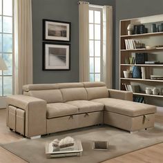 a living room with a sectional couch and bookshelf in the corner on carpeted flooring