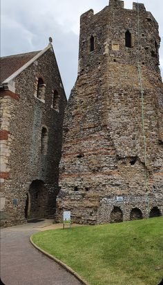 an old brick building with two towers on each side