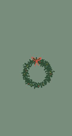 a green christmas wreath with red bows and lights hanging from it's sides on a gray background