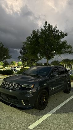 a black jeep parked in a parking lot