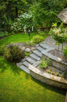 an outdoor garden with steps and landscaping