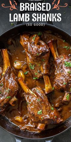 the finished lamb shanks in a skillet with text overlay that reads, braised lamb shanks