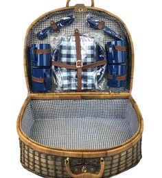 an open suitcase with blue and white plaid items inside on a white background in the image