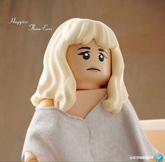 a lego figure with blonde hair and eyes